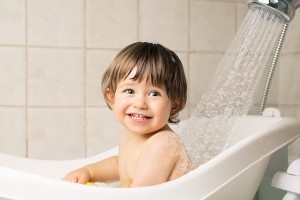 bigstock-Baby-Bathing-57176954-300x200